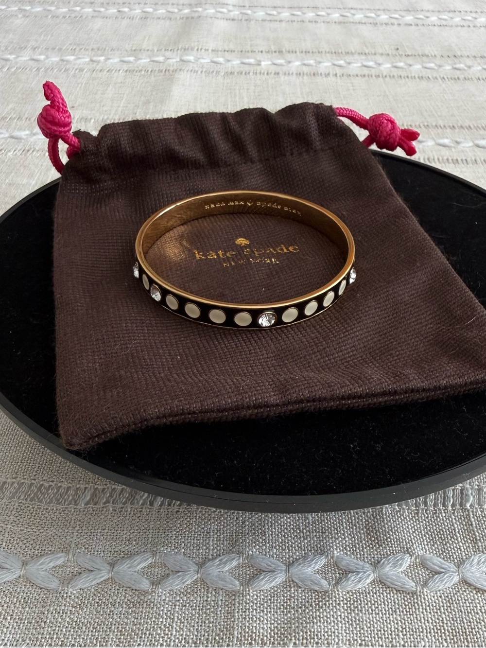 Kate Spade Gold-Tone Black Enamel Bangle with White Dot Accents